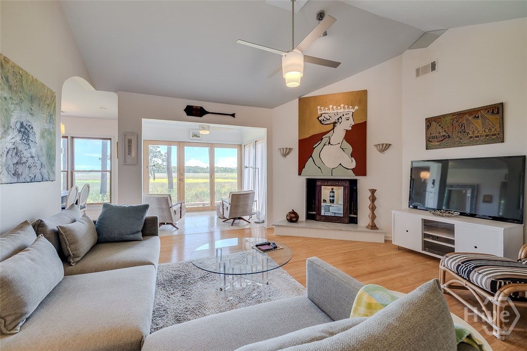 211 Runaway Point Road Savannah, GA 31404 - Photo 7 of 56 The living room's cathedral ceiling enhances the w