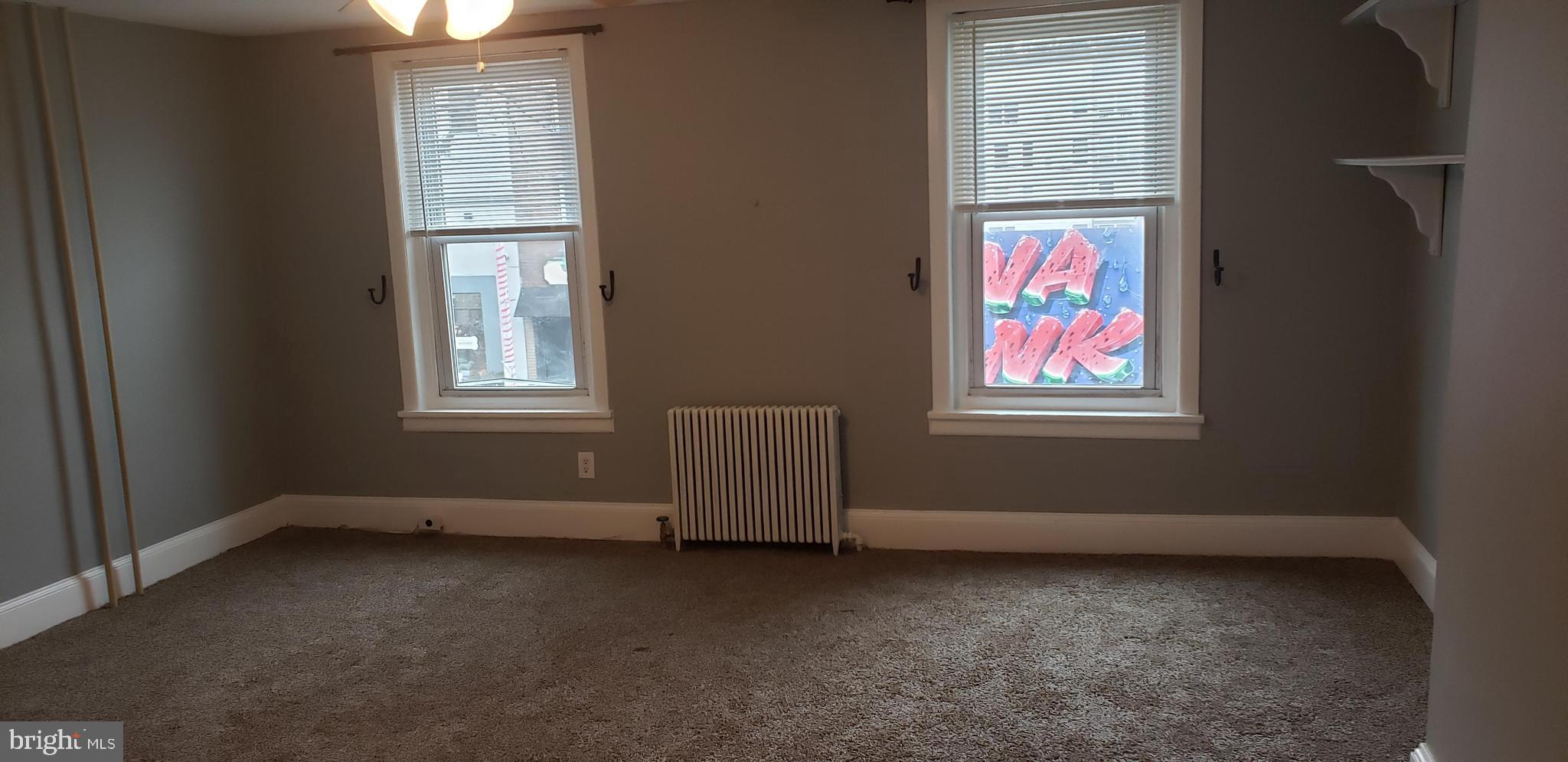 4329 Main Street, Unit 2 Philadelphia, PA 19127 - Photo 4 of 5 an empty room with windows