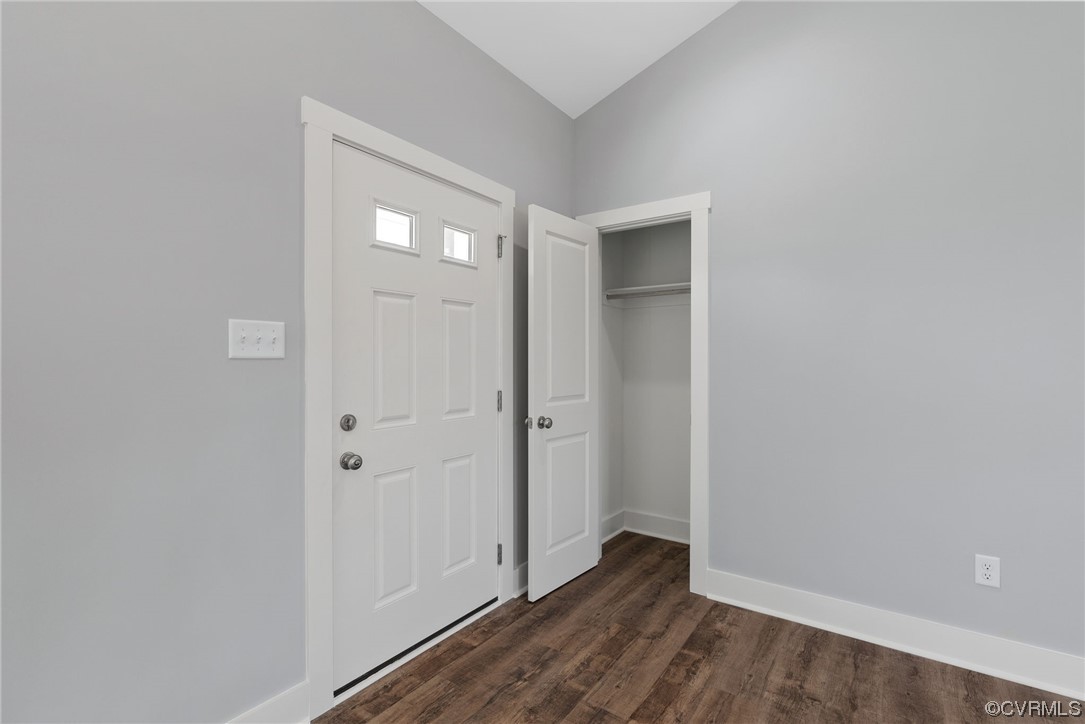326 Moore Road Farmville, VA 23901 - Photo 23 of 50 an empty room with wooden floor and windows
