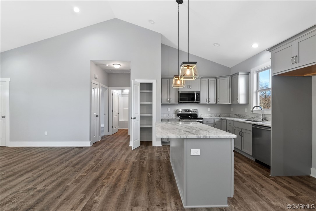 326 Moore Road Farmville, VA 23901 - Photo 25 of 50 a large kitchen with stainless steel appliances granite countertop a lot of counter space and a wooden floor