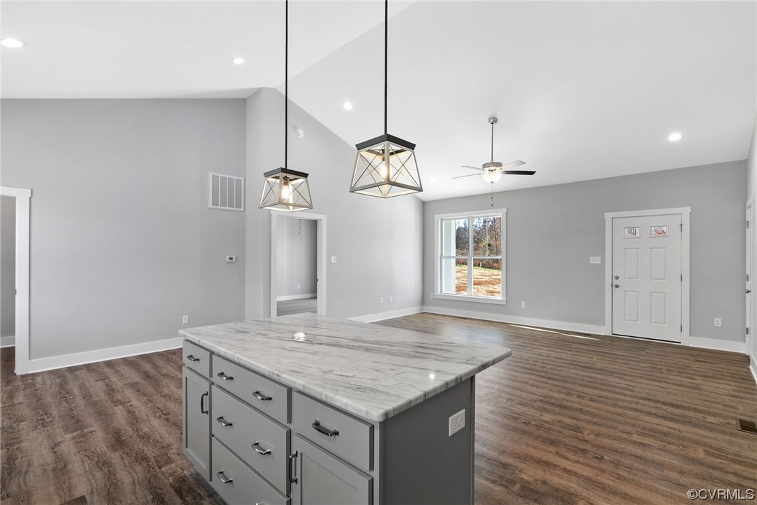 326 Moore Road Farmville, VA 23901 - Photo 29 of 50 a kitchen with kitchen island white cabinets and wooden floor
