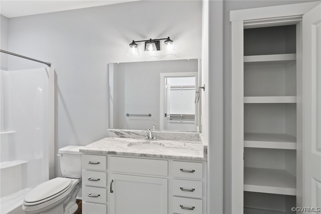 326 Moore Road Farmville, VA 23901 - Photo 35 of 50 a bathroom with a granite countertop sink toilet a mirror and vanity