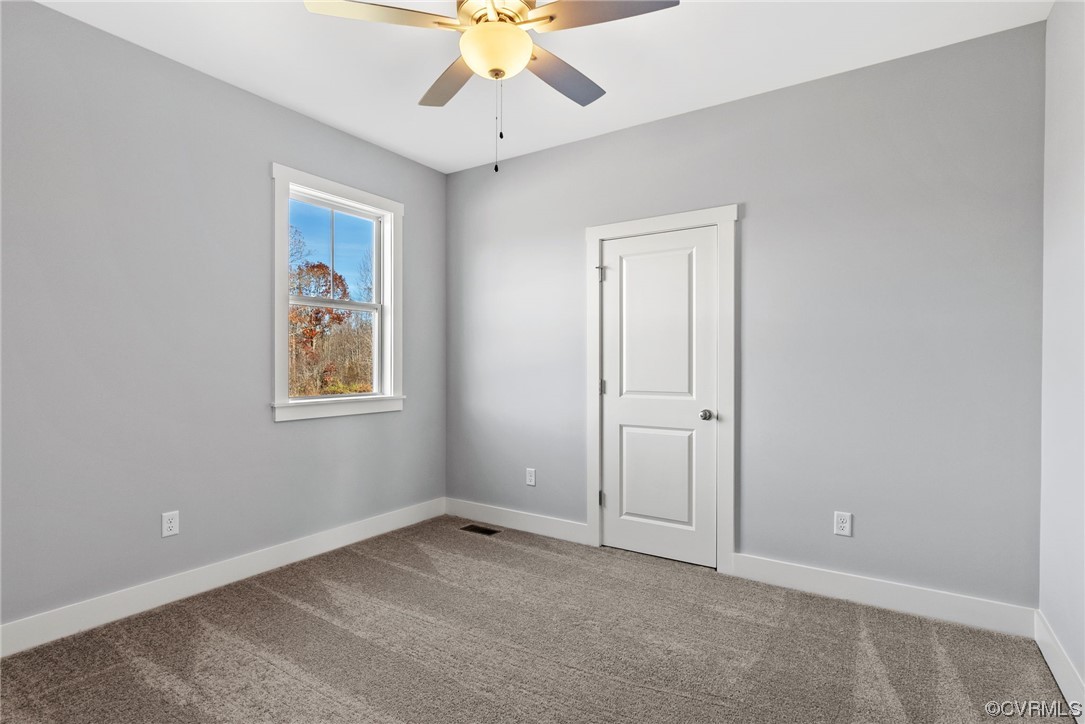 326 Moore Road Farmville, VA 23901 - Photo 43 of 50 an empty room with a window and a fan