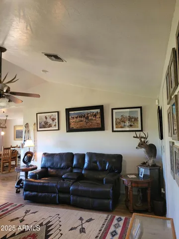 a view of livingroom with furniture and workspace