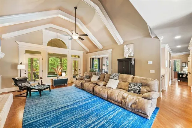 a kitchen with stainless steel appliances granite countertop a sink a stove and cabinets