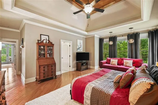 a en suite bathroom with a granite countertop toilet sink and mirror