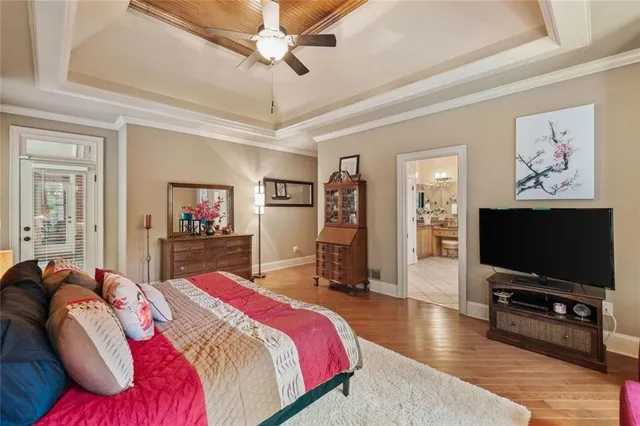 a bathroom with a granite countertop toilet a sink and a mirror