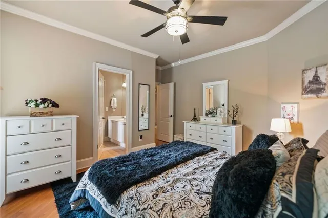 a living room with furniture and a book shelf
