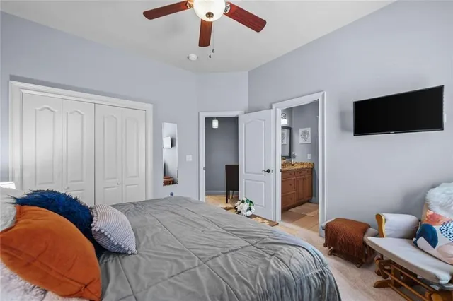 an aerial view of a house with outdoor space and trees all around