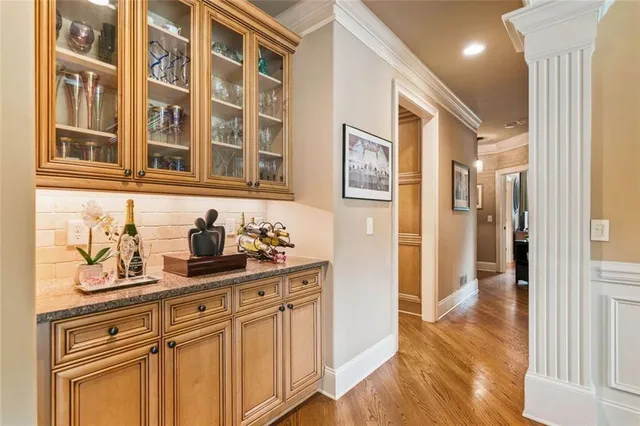 a living room with furniture wooden floor and a flat screen tv