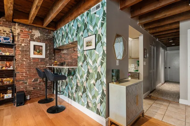 a kitchen with stainless steel appliances kitchen island granite countertop a refrigerator and a stove