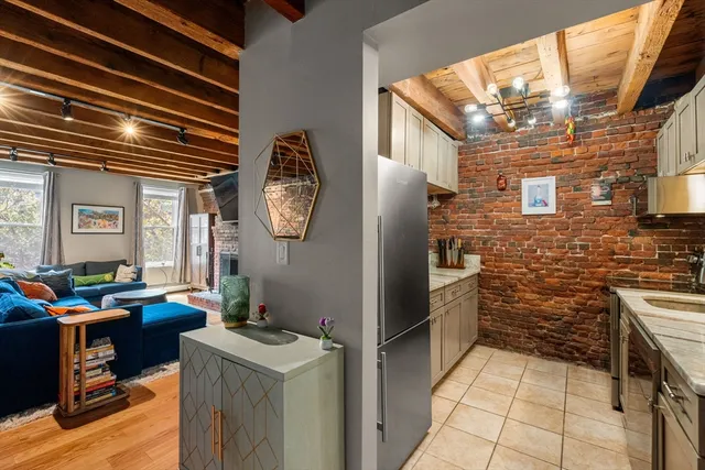a kitchen with a refrigerator and countertop