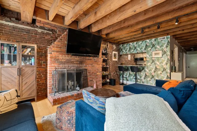 a outdoor living space with fireplace furniture and a flat screen tv