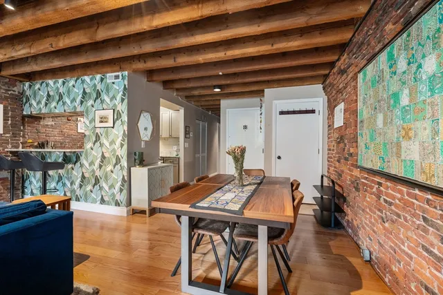 a view of a dining room with furniture and window