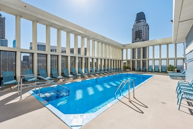 100 East Walton Street, Unit 11B Chicago, IL 60611 - Photo 12 of 13 a view of swimming pool with seating area