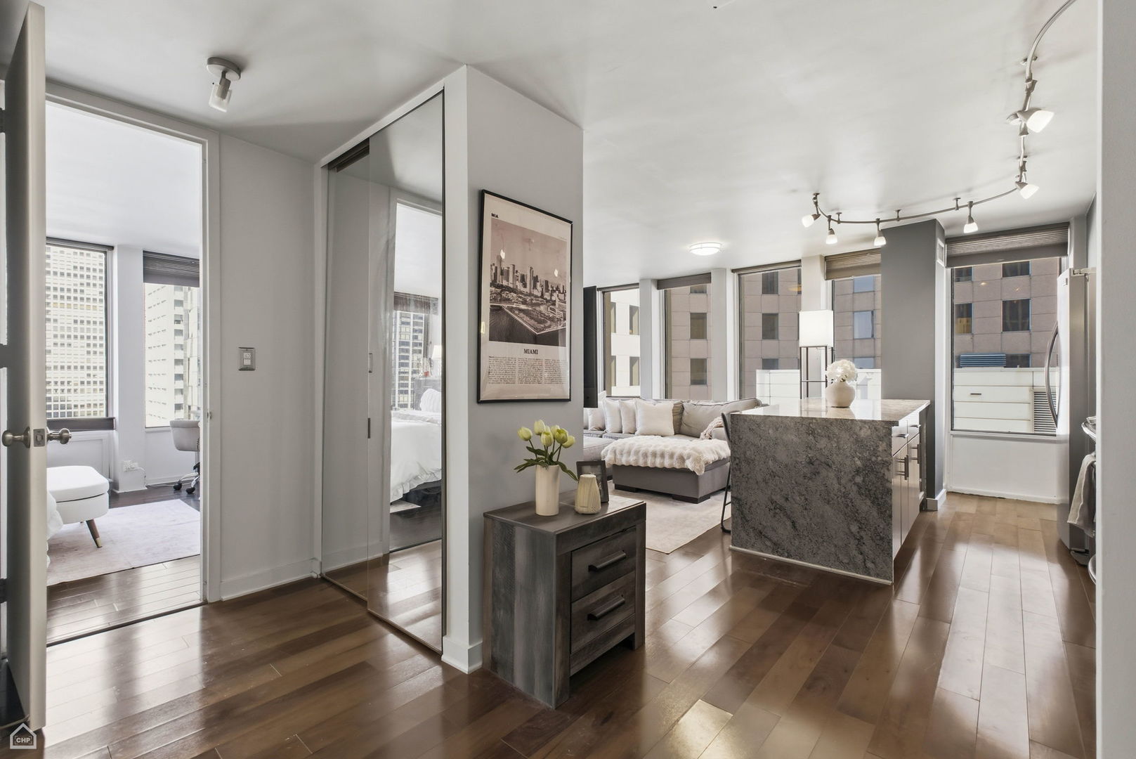 100 East Walton Street, Unit 11B Chicago, IL 60611 - Photo 2 of 13 a living room with furniture and wooden floor