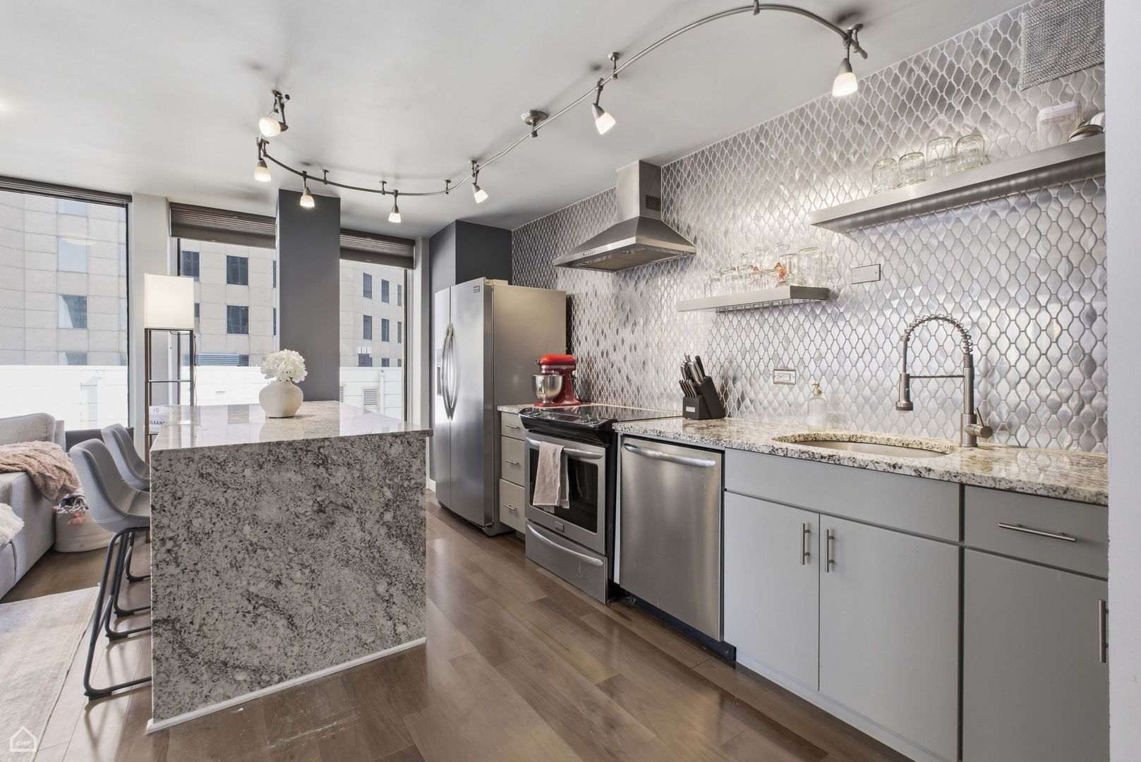 100 East Walton Street, Unit 11B Chicago, IL 60611 - Photo 3 of 13 a kitchen with stainless steel appliances granite countertop a sink and stove