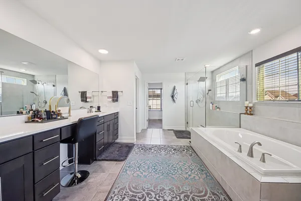 a bathroom with a bathtub and shower