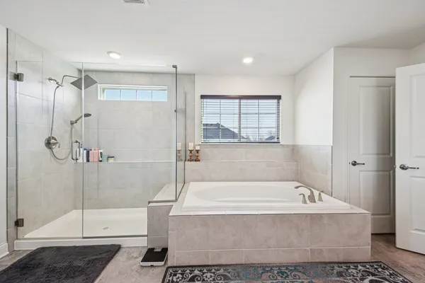 a bedroom with a bed and a tv