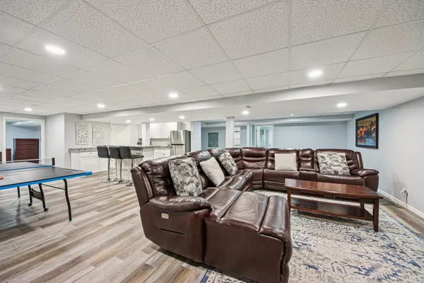a living room with furniture and a table