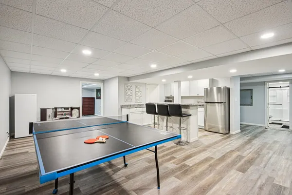 a large kitchen with stainless steel appliances granite countertop a large counter top and a stove top oven