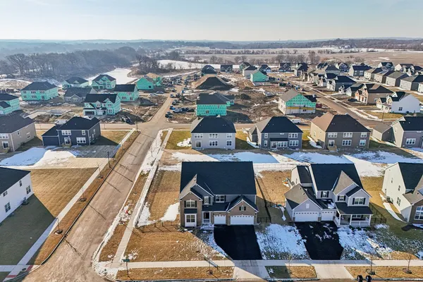 an aerial view of residential building and parking space
