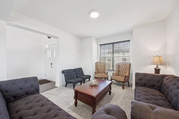 a living room with furniture or couch and a window