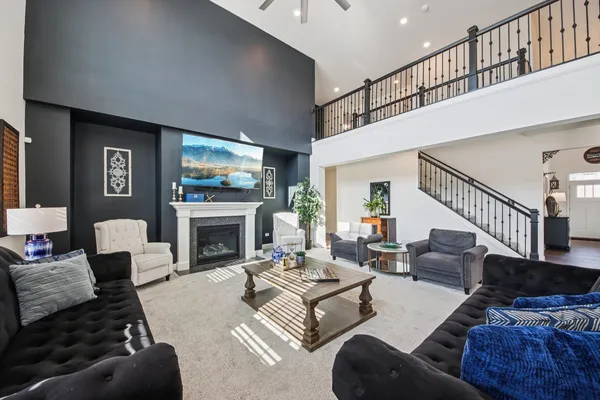 a living room with furniture fireplace and a flat screen tv