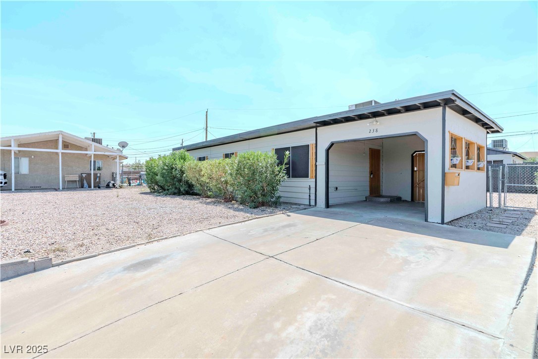 238 Kansas Avenue Henderson, NV 89015 - Photo 1 of 61 View of front of house featuring concrete driveway, a gate, and stucco siding