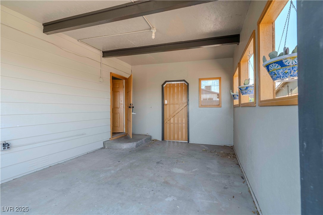 238 Kansas Avenue Henderson, NV 89015 - Photo 3 of 61 Doorway to property with stucco siding and a patio