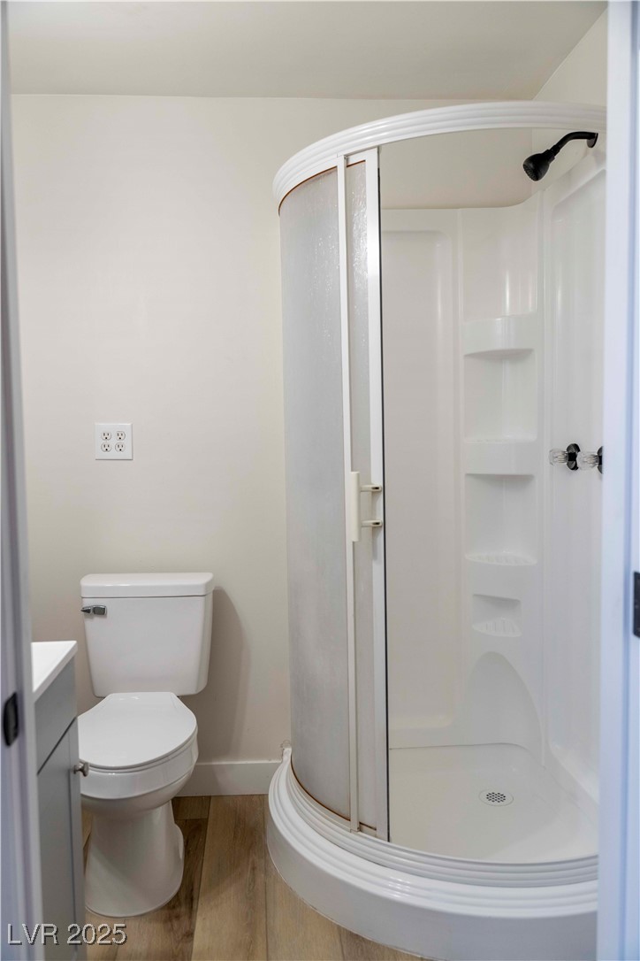 238 Kansas Avenue Henderson, NV 89015 - Photo 31 of 61 Bathroom with wood finished floors, a stall shower, and vanity