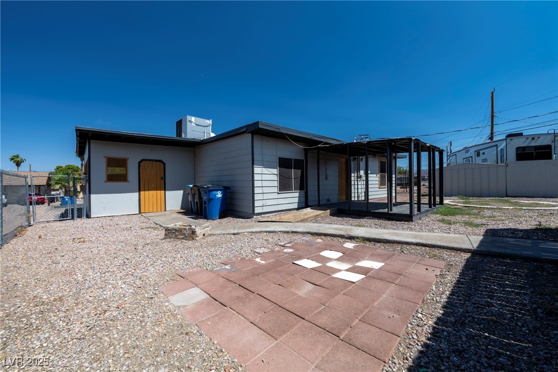 238 Kansas Avenue Henderson, NV 89015 - Photo 38 of 61 Rear view of property with a sunroom and a gate