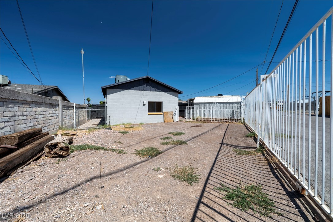 238 Kansas Avenue Henderson, NV 89015 - Photo 47 of 61 Back of property featuring a fenced backyard