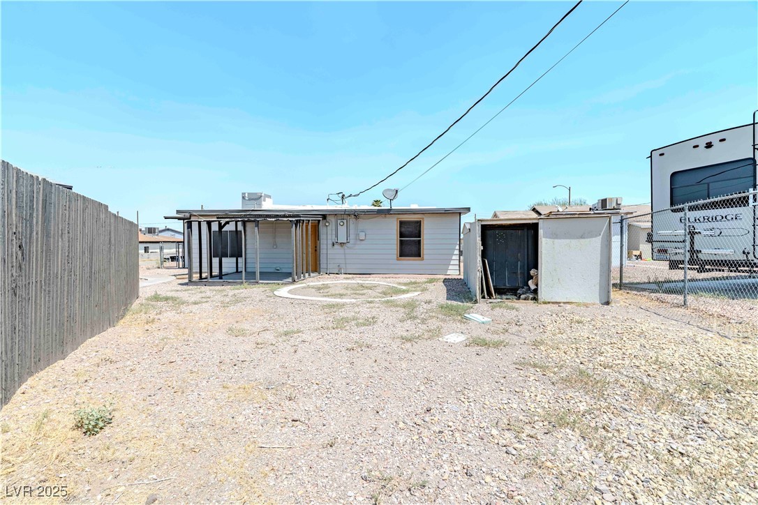 238 Kansas Avenue Henderson, NV 89015 - Photo 60 of 61 Back of property with a fenced backyard and a patio