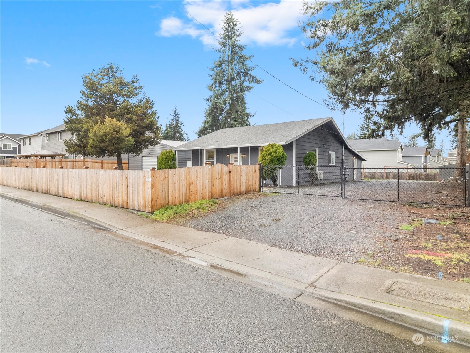 9331 Cullens Road Southeast Yelm, WA 98597 - Photo 2 of 28 a view of a house with a yard and garage