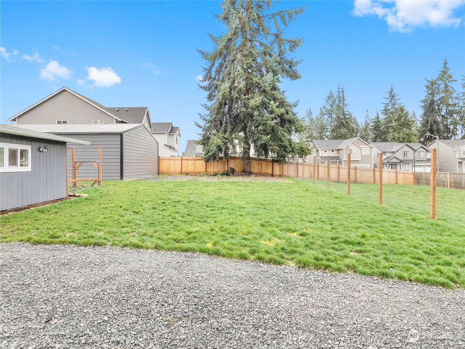 9331 Cullens Road Southeast Yelm, WA 98597 - Photo 21 of 28 a view of a backyard with a garden