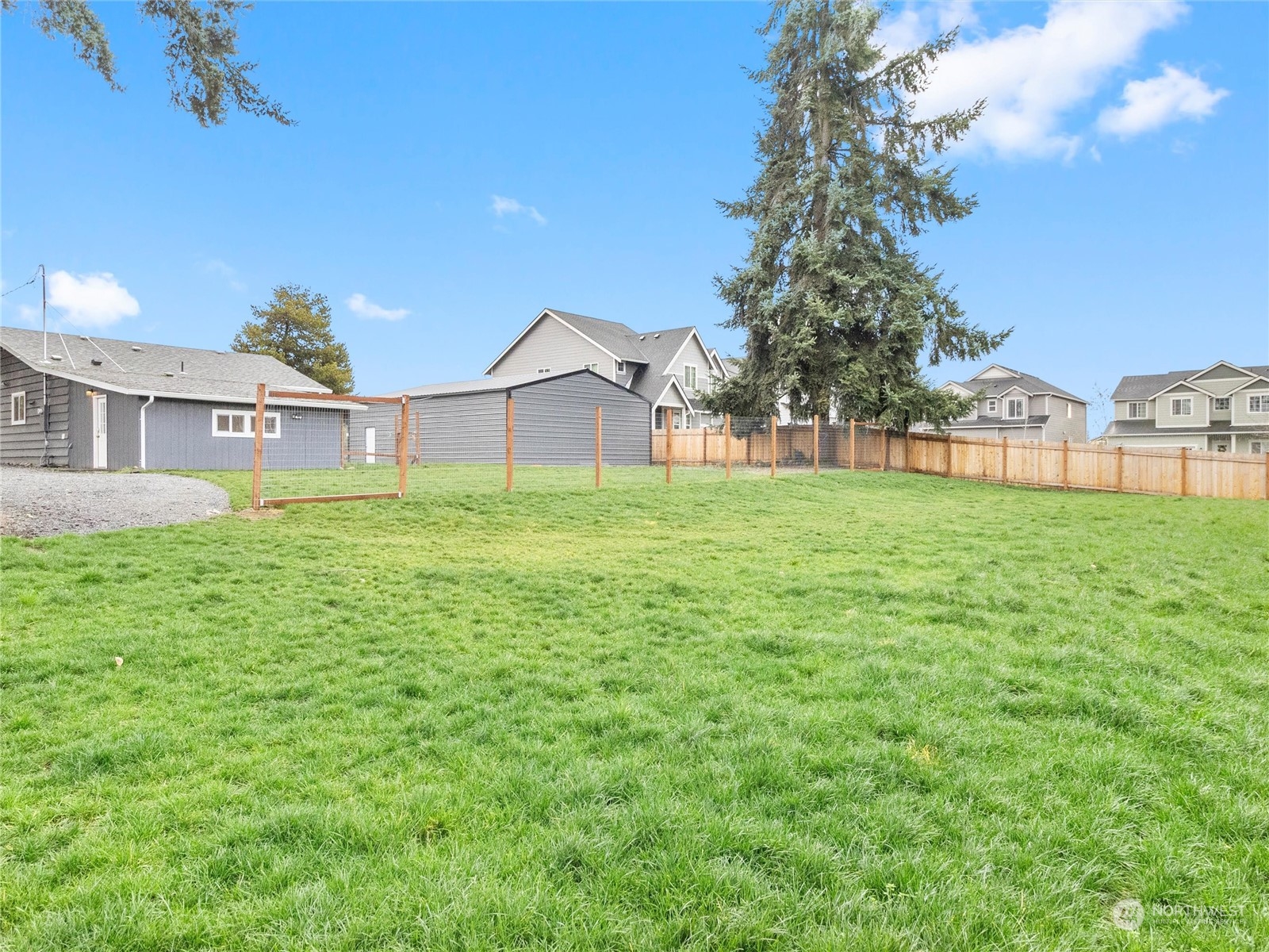 9331 Cullens Road Southeast Yelm, WA 98597 - Photo 22 of 28 a house view with a garden space