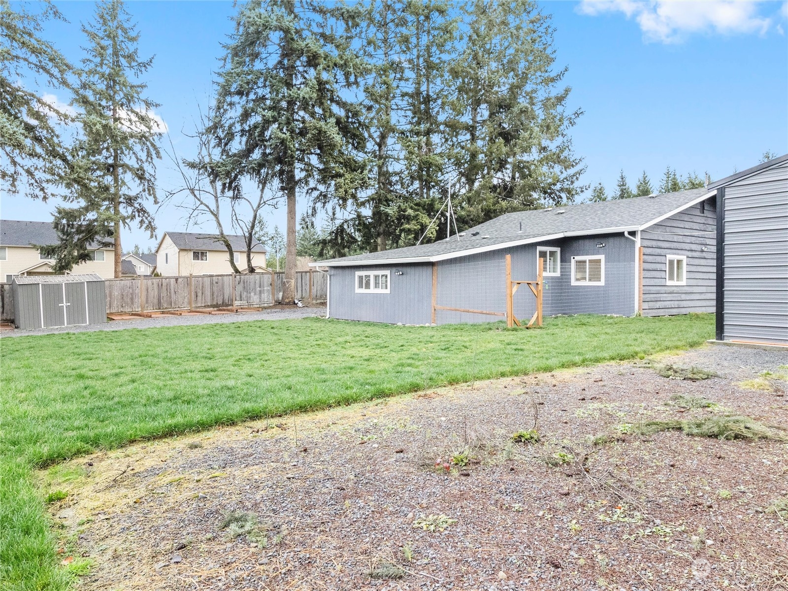9331 Cullens Road Southeast Yelm, WA 98597 - Photo 23 of 28 a front view of house with yard and green space