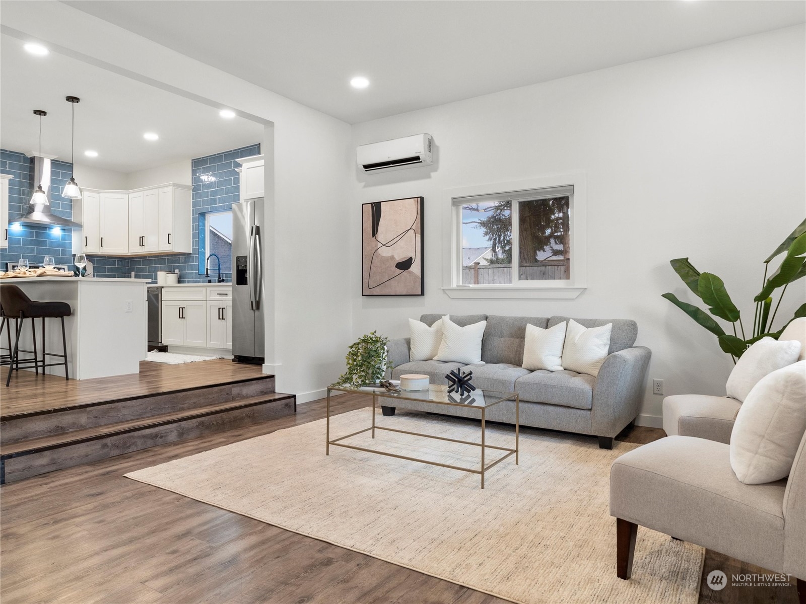 9331 Cullens Road Southeast Yelm, WA 98597 - Photo 4 of 28 a living room with furniture and kitchen view