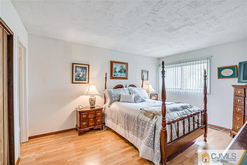 12 Pyne Road Kendall Park, NJ 08824 - Photo 8 of 15 a bedroom with a bed and a window