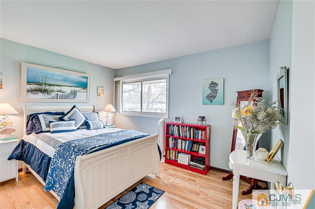 12 Pyne Road Kendall Park, NJ 08824 - Photo 10 of 15 a bed room with furniture and a book shelf