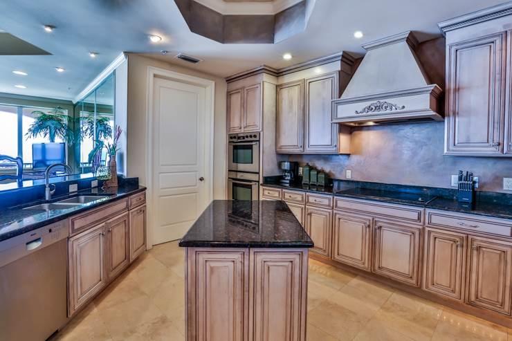 50 Surf Song Lane, Unit E514 Miramar Beach, FL 32550 - Photo 12 of 28 a kitchen with stainless steel appliances a sink stove and cabinets