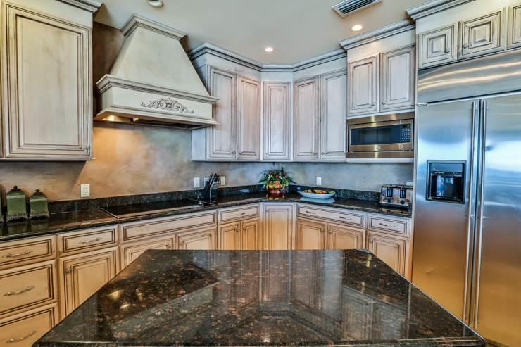 50 Surf Song Lane, Unit E514 Miramar Beach, FL 32550 - Photo 14 of 28 a kitchen with stainless steel appliances granite countertop a refrigerator a stove and a sink