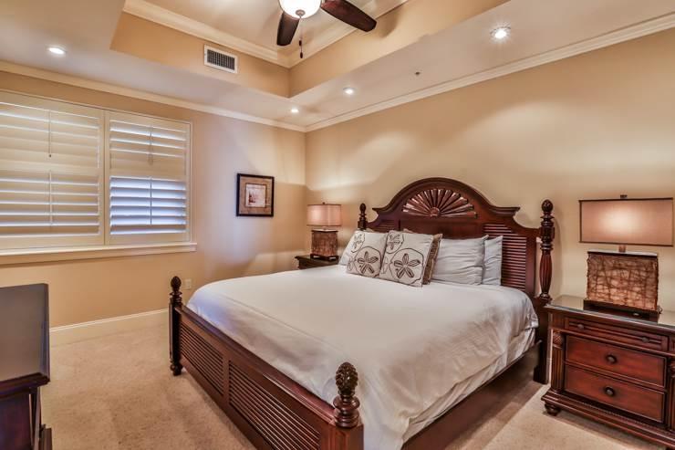 50 Surf Song Lane, Unit E514 Miramar Beach, FL 32550 - Photo 19 of 28 a bedroom with a bed and a ceiling fan