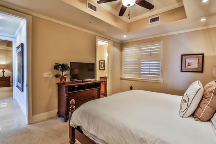 50 Surf Song Lane, Unit E514 Miramar Beach, FL 32550 - Photo 20 of 28 a bedroom with a bed and a flat screen tv