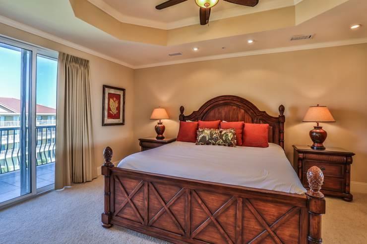 50 Surf Song Lane, Unit E514 Miramar Beach, FL 32550 - Photo 22 of 28 a bedroom with a bed and a potted plant