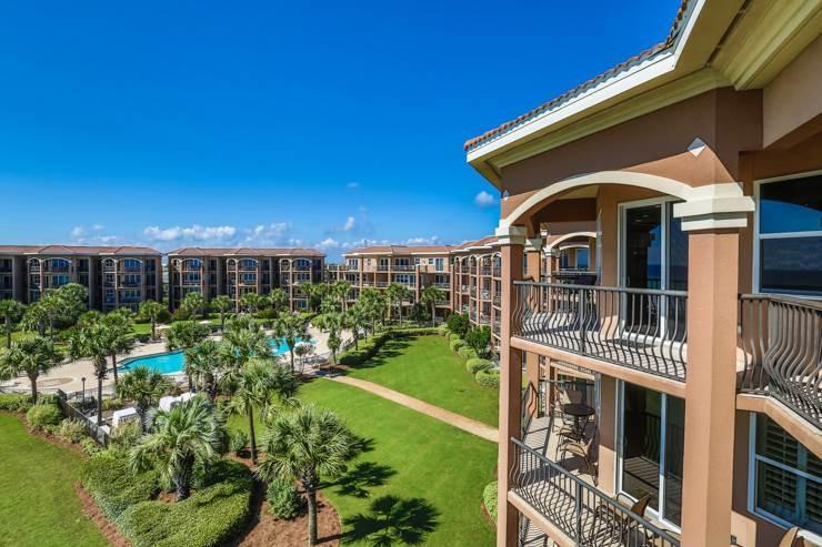 50 Surf Song Lane, Unit E514 Miramar Beach, FL 32550 - Photo 26 of 28 a front view of a house with a yard