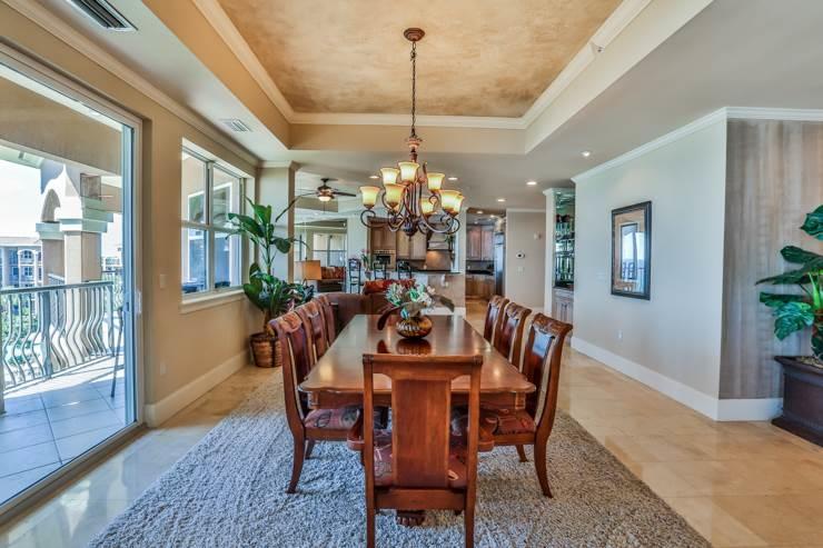 50 Surf Song Lane, Unit E514 Miramar Beach, FL 32550 - Photo 5 of 28 a dining room with furniture a chandelier and wooden floor