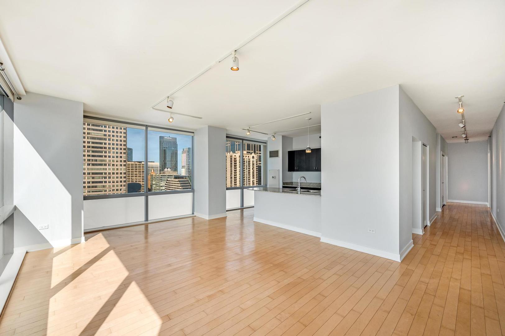 8 East Randolph Street, Unit 3108 Chicago, IL 60601 - Photo 4 of 17 a view of a livingroom with wooden floor