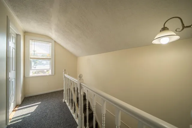 a view of a hallway with windows